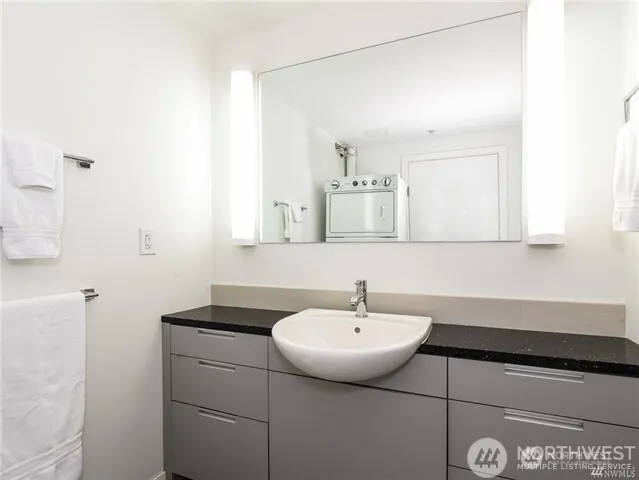 a bathroom with a sink and mirror