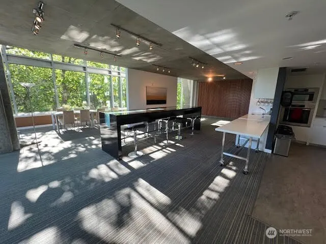 a room with lots of furniture and a large window