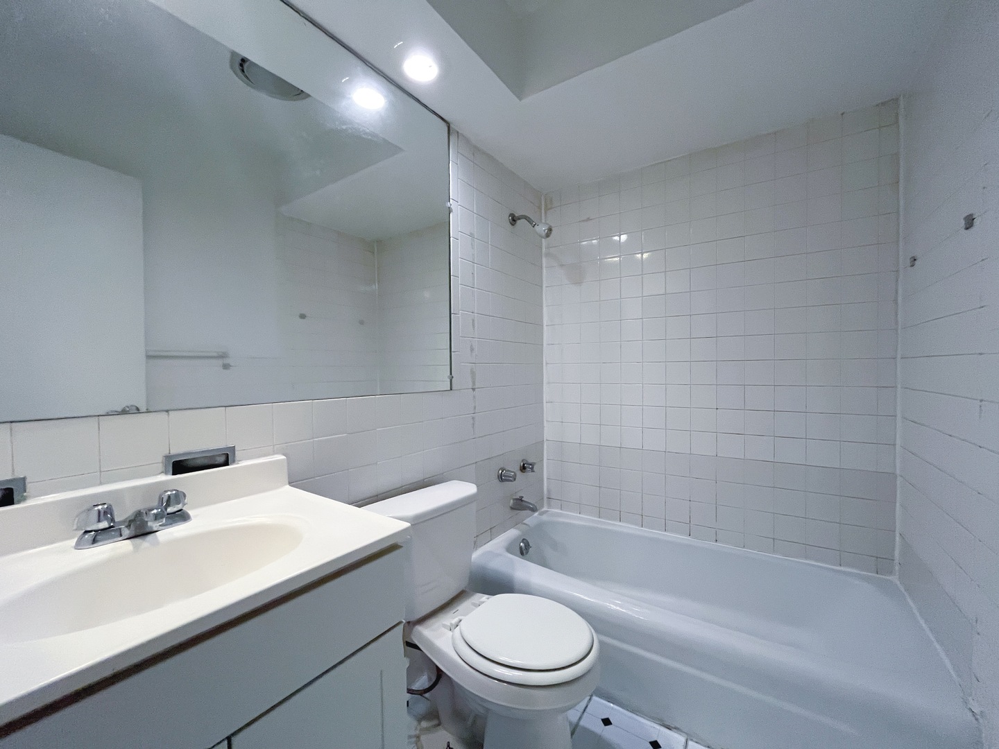 736 West Buena Avenue, Unit 307 Chicago, IL 60613 - Photo 9 of 9 a bathroom with a sink a toilet and shower