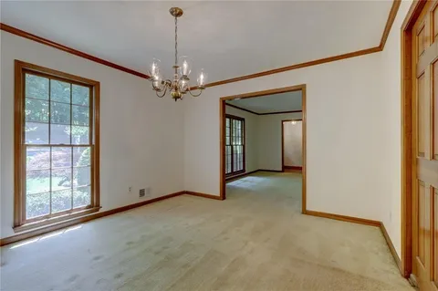 a view of an empty room with stairs