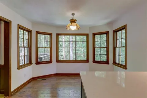 a kitchen with stainless steel appliances a refrigerator and a stove top oven