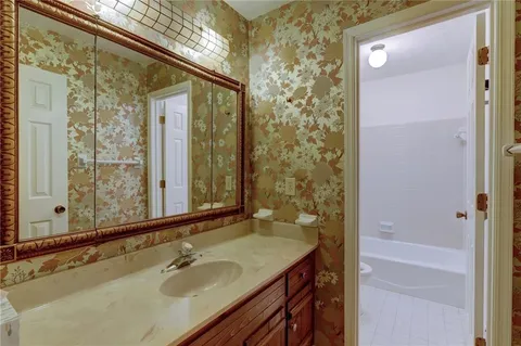 a bathroom with a sink and a mirror
