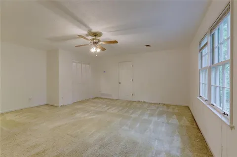 a view of an empty room with a sliding door