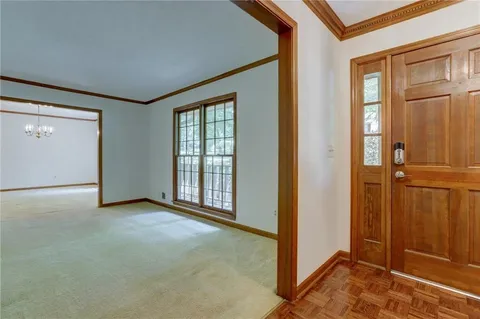 a view of a room with large windows