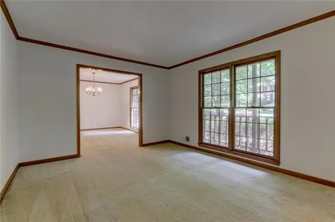 a view of a chandelier fan and entryway