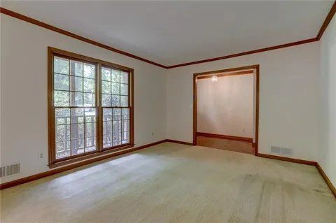 a view of a windows and chandelier in the room