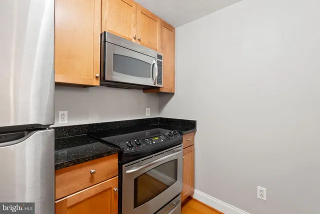 a kitchen with a stove and a microwave