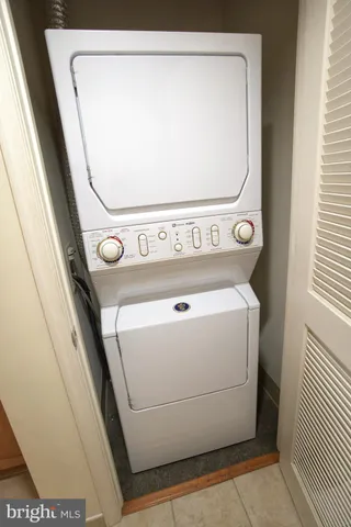 a close up view of a refrigerator with washer and dryer