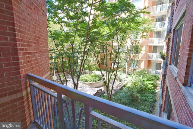 a view of a balcony with a tree