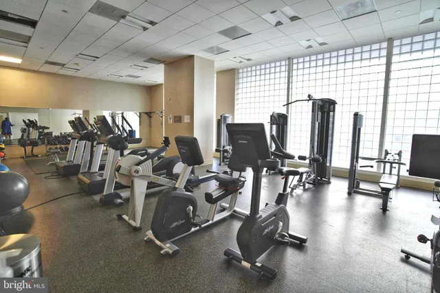 a living room with furniture a projector and a projector