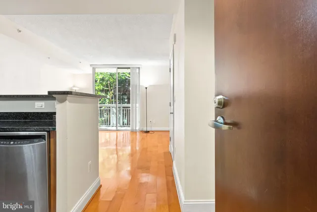 a view of a kitchen from the hallway