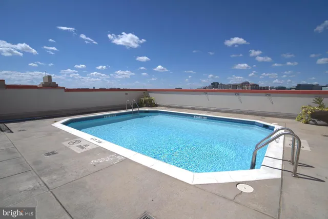 a view of a kitchen with a dishwasher and furniture