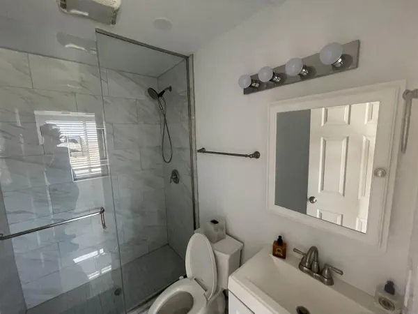 a bathroom with a sink and mirror