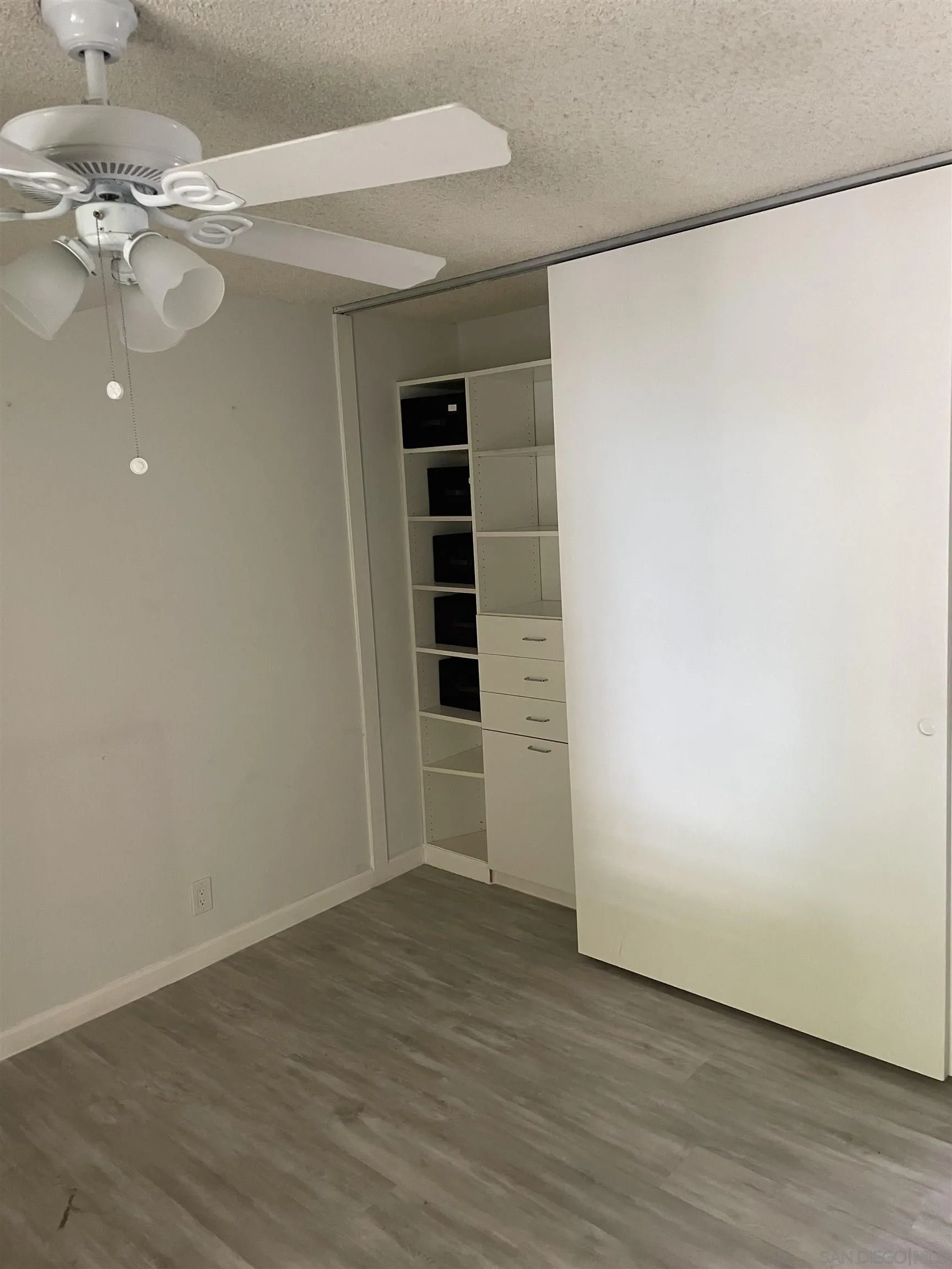 64281 Spyglass Avenue, Unit 42 Desert Hot Springs, CA 92240 - Photo 6 of 19 wooden floor in an empty room with a window