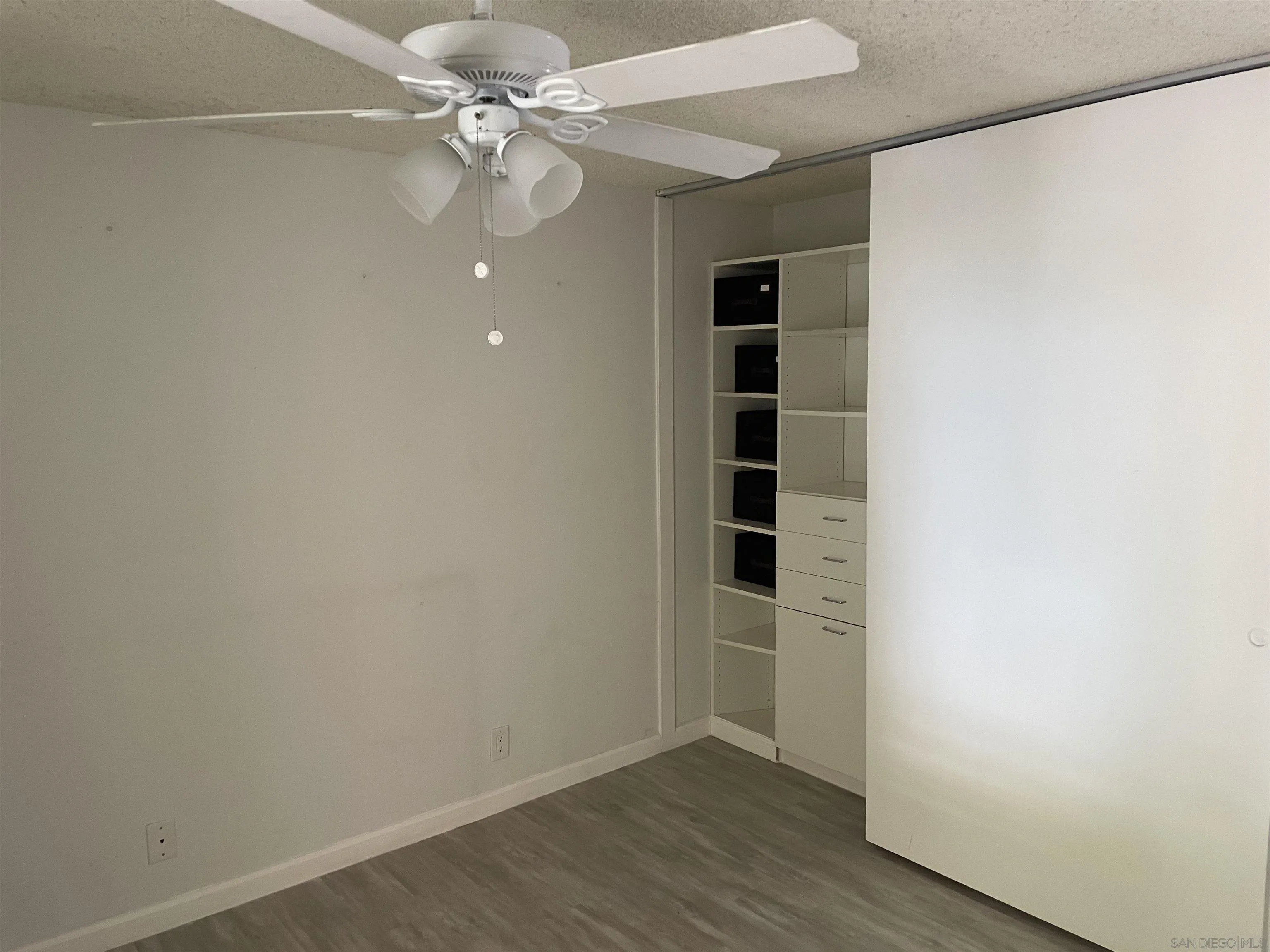 64281 Spyglass Avenue, Unit 42 Desert Hot Springs, CA 92240 - Photo 7 of 19 an empty room with a empty space and a ceiling fan