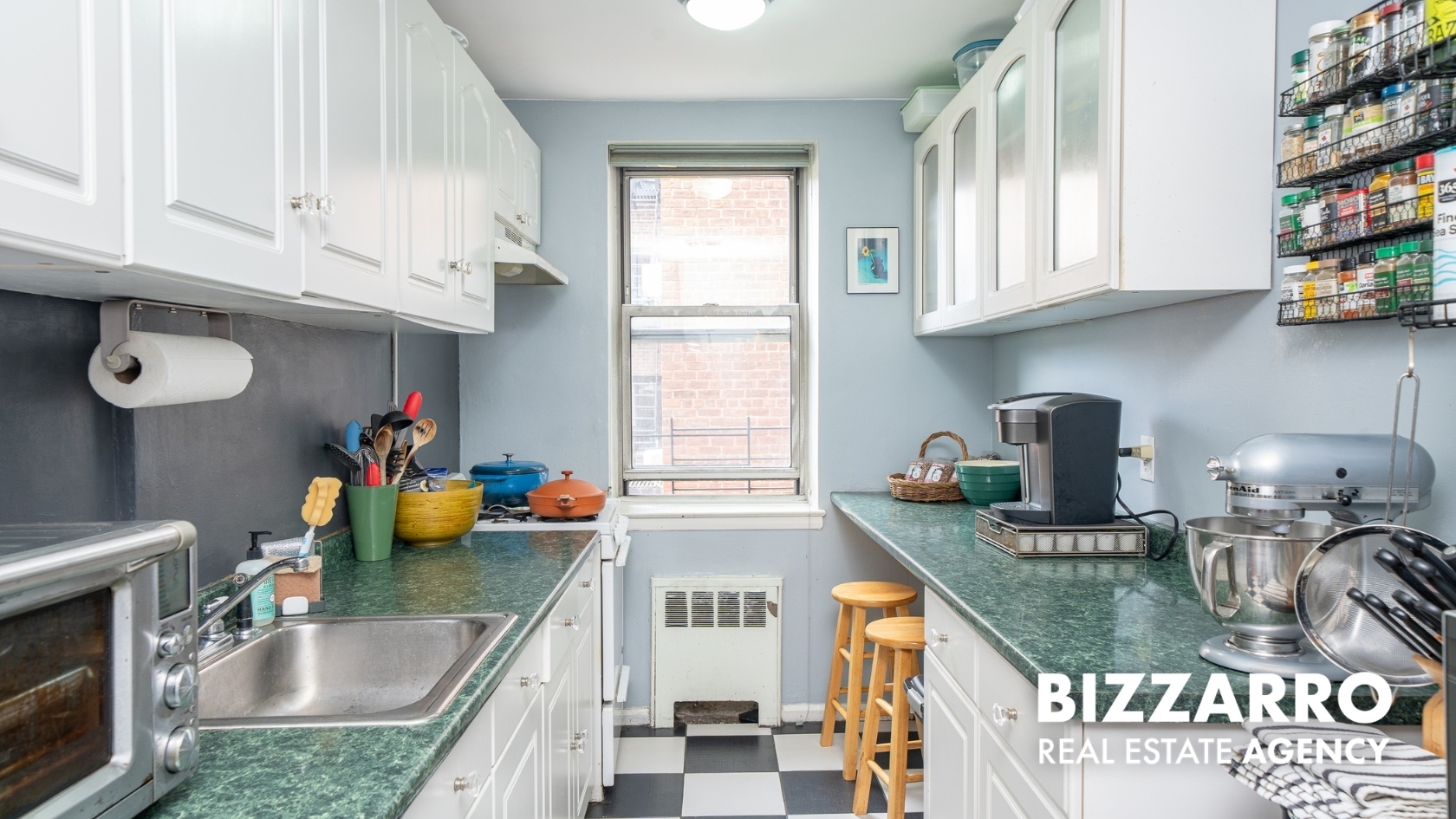 Undisclosed Address Manhattan, NY 10040 - Photo 7 of 14 a kitchen with stainless steel appliances granite countertop a sink stove and cabinets