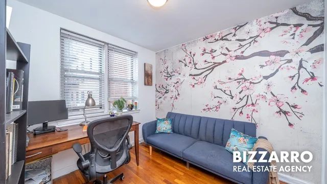 a living room with a couch and a window