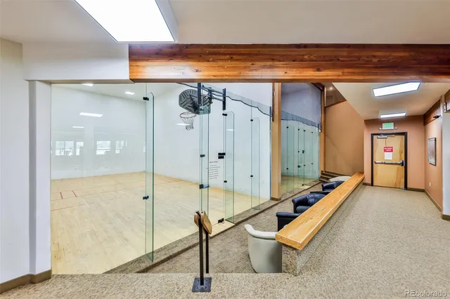 a room with pool table and glass door