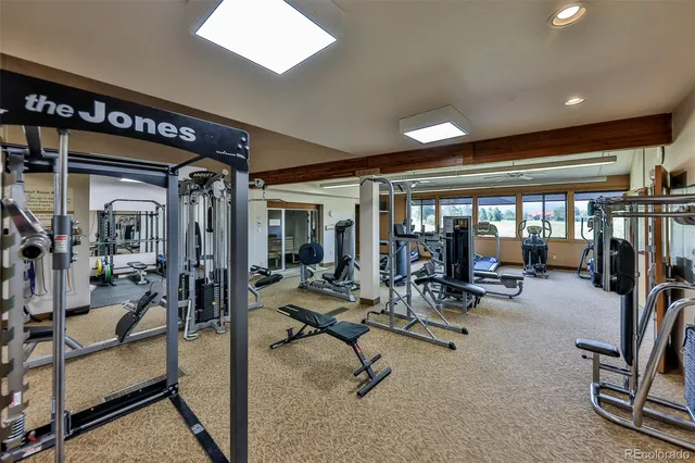 a view of a livingroom with gym equipment