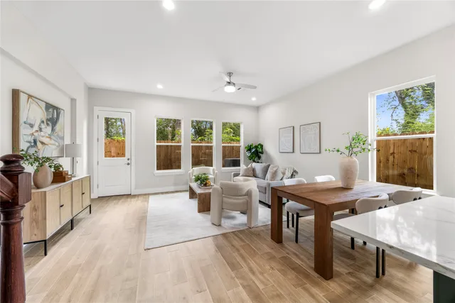 a view of a dining room with furniture window and wooden floor