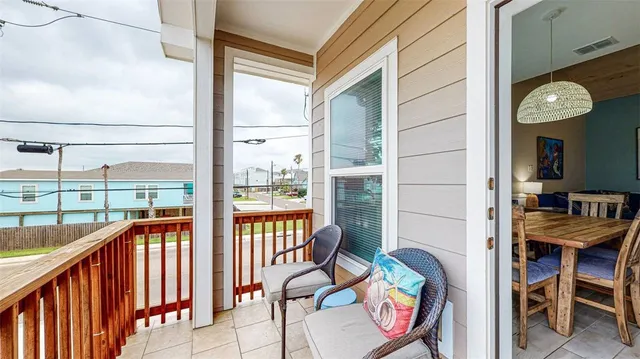 a view of a balcony with chairs