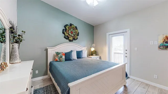 a bedroom with a bed and a table in it