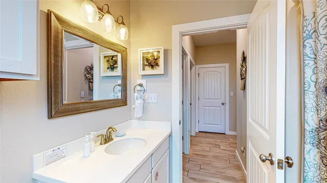 a bathroom with a sink and a mirror