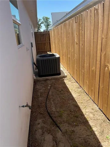 a view of a balcony with wooden fence