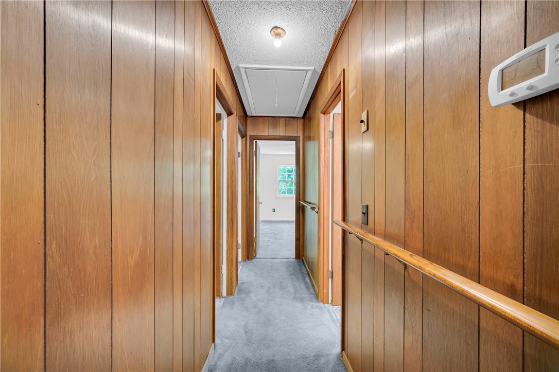 952 Stephens Drive Westminster, SC 29693 - Photo 31 of 50 A well-lit hallway with natural wood paneling.
