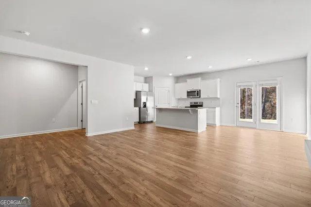 a view of kitchen with wooden floor and windows