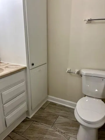 a bathroom with a toilet and a sink