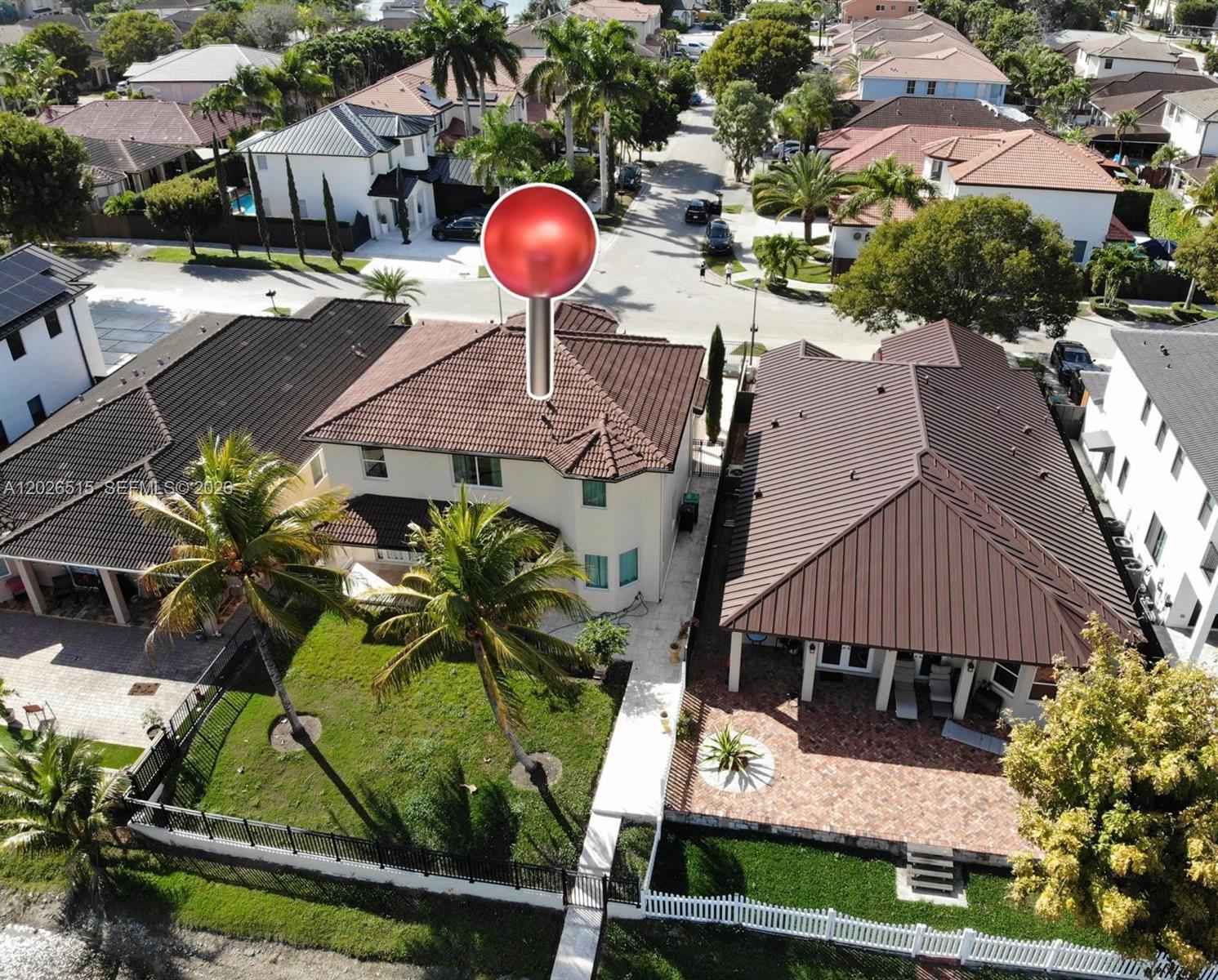 1065 Southwest 150th Place Miami, FL 33194 - Photo 14 of 14 a view of a house with a swimming pool