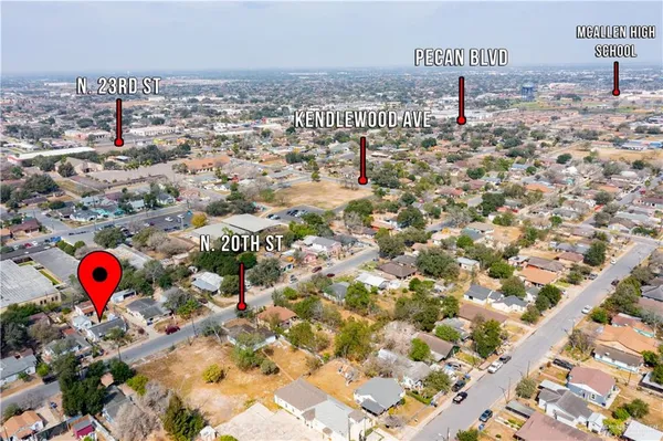 an aerial view of residential houses with outdoor space