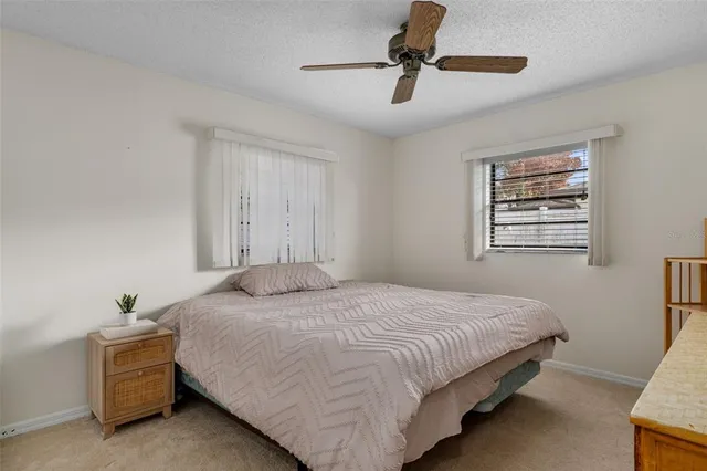 a bedroom with bed and window