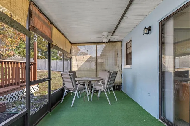 a dining room with furniture and a garden
