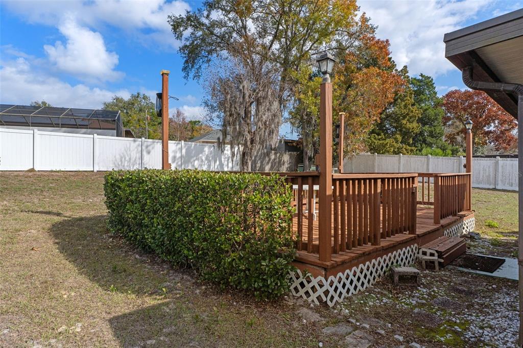 2300 Restmere Lane Spring Hill, FL 34609 - Photo 28 of 28 a view of a garden with wooden fence