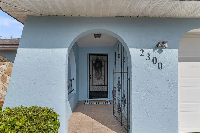 a view of a hallway to a livingroom