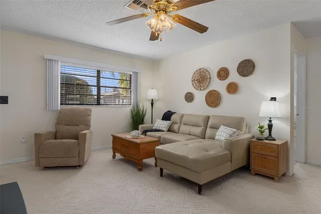 a living room with furniture and window