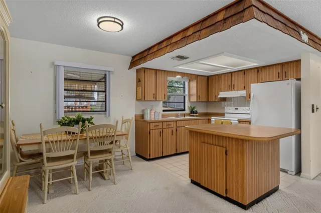 a kitchen with appliances cabinets and a sink