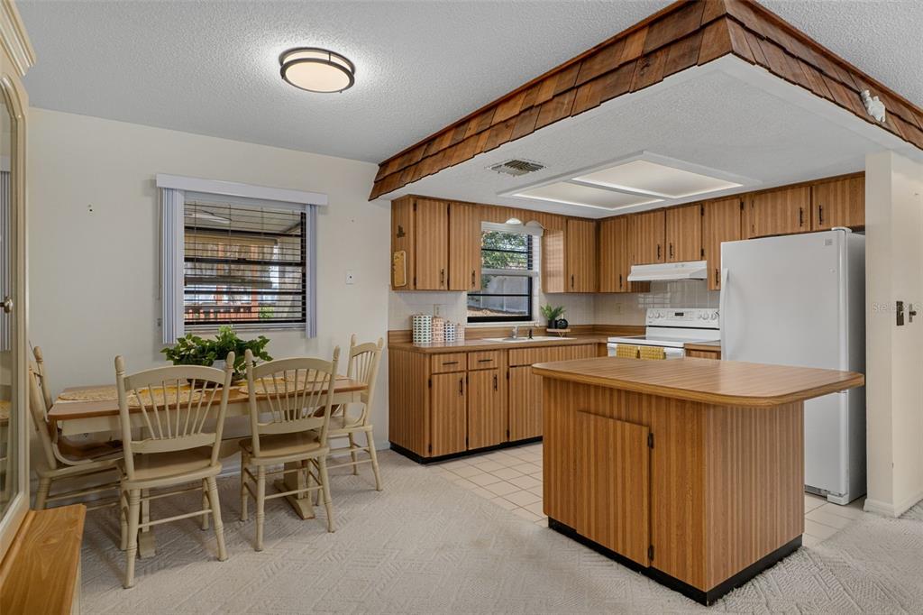 2300 Restmere Lane Spring Hill, FL 34609 - Photo 7 of 28 a kitchen with appliances cabinets and a sink