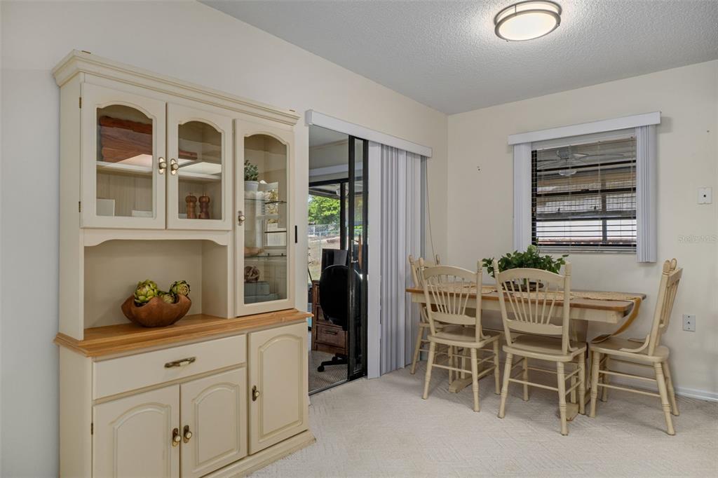 2300 Restmere Lane Spring Hill, FL 34609 - Photo 10 of 28 a dining room with furniture and window