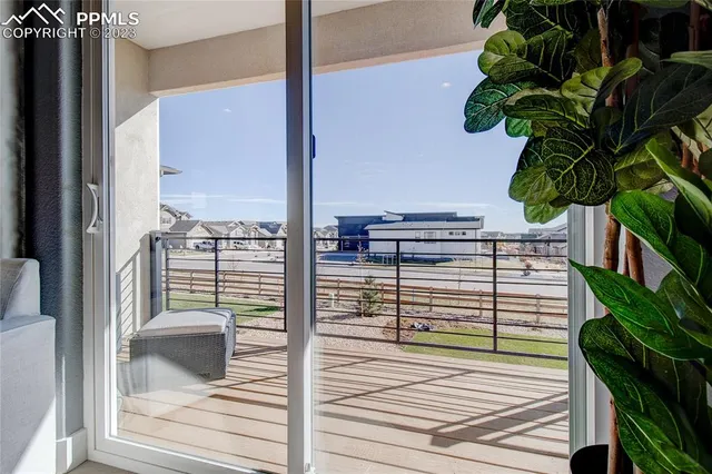 a view of a balcony with potted plants