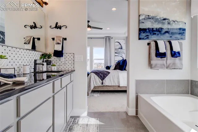 a en suite bathroom with a double vanity sink