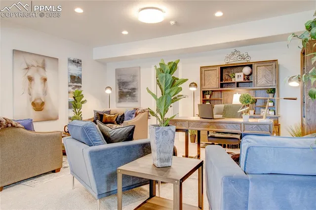 a living room with furniture and window