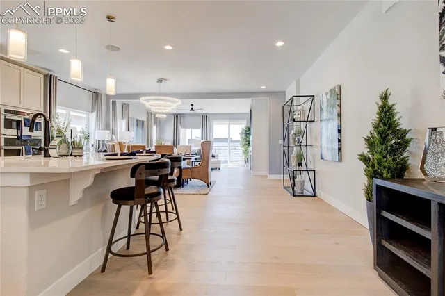 a kitchen with stainless steel appliances kitchen island granite countertop a refrigerator and a stove top oven