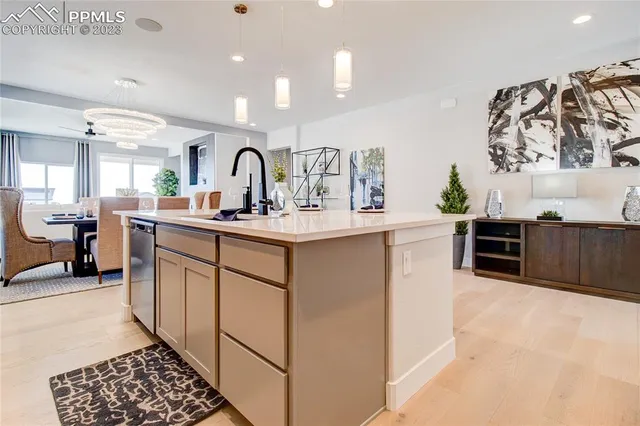 a kitchen with stainless steel appliances granite countertop a sink and cabinets