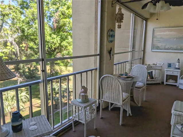 a balcony with chairs and with furniture