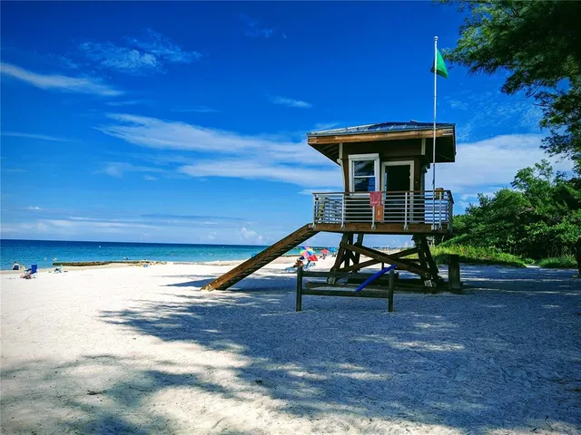 a view of swimming pool with outdoor seating