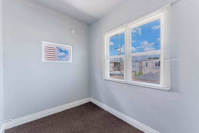 4820 West Wolfram Street, Unit 2 Chicago, IL 60641 - Photo 16 of 17 a view of an empty room with a window