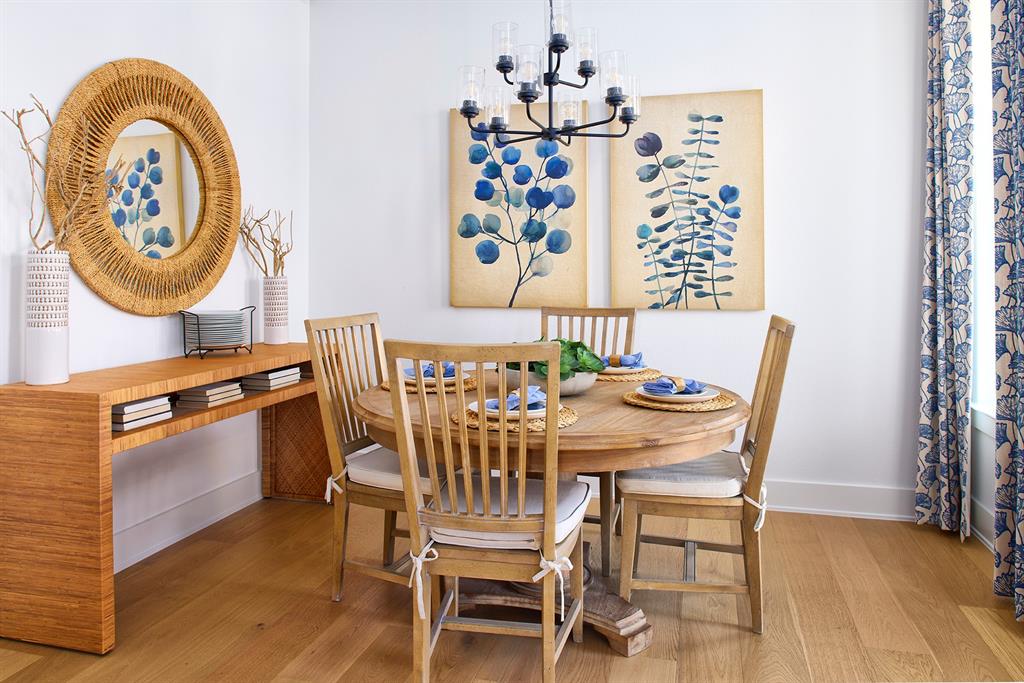 651 Caprice Bluff Fate, TX 75189 - Photo 10 of 26 a view of a dining room with furniture and wooden floor